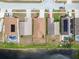 An aerial view of the backs of several homes along a pond at 12531 Midpointe Dr, Riverview, FL 33578