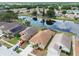 Aerial view of the property, highlighting its location on a pond and landscaped front yard at 12531 Midpointe Dr, Riverview, FL 33578