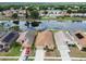 Aerial view of a neighborhood featuring homes on a pond, showcasing a beautiful residential setting at 12531 Midpointe Dr, Riverview, FL 33578