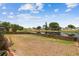 Expansive backyard featuring a serene lake view and wooden fencing at 12531 Midpointe Dr, Riverview, FL 33578