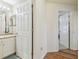 Cozy bathroom with tile floor and white vanity, offering a simple space for personal care at 12531 Midpointe Dr, Riverview, FL 33578
