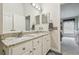 Bathroom vanity with double sinks and granite countertop at 12531 Midpointe Dr, Riverview, FL 33578