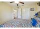 Comfortable bedroom with neutral decor and a queen bed, providing a peaceful and relaxing atmosphere at 12531 Midpointe Dr, Riverview, FL 33578