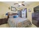 Comfortable bedroom with neutral decor and a full bed, providing a peaceful and relaxing atmosphere at 12531 Midpointe Dr, Riverview, FL 33578