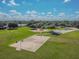 Aerial view of community park amenities including a basketball court, playground, and picnic area at 12531 Midpointe Dr, Riverview, FL 33578