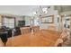 Open-concept dining area flowing into the living room at 12531 Midpointe Dr, Riverview, FL 33578