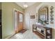 Inviting foyer with stylish decor, tile flooring, and a view into the living room at 12531 Midpointe Dr, Riverview, FL 33578