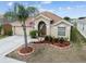 Beautiful home with a well-kept yard, mature landscaping, and a convenient two-car garage at 12531 Midpointe Dr, Riverview, FL 33578