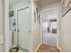 Hallway with doors leading to a bedroom and laundry area at 12531 Midpointe Dr, Riverview, FL 33578