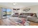 Inviting living room with hardwood floors and neutral tones, perfect for relaxation and entertainment at 12531 Midpointe Dr, Riverview, FL 33578