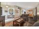 Comfortable living room with modern decor, and view into dining area at 12531 Midpointe Dr, Riverview, FL 33578