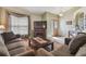 Cozy living room with fireplace, comfortable seating, and modern decor at 12531 Midpointe Dr, Riverview, FL 33578