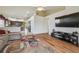 Bright and spacious living room with wood floors, offering a cozy and inviting atmosphere for residents at 12531 Midpointe Dr, Riverview, FL 33578