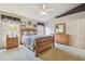 Comfortable bedroom with a wooden bed frame, dresser, and neutral decor at 12531 Midpointe Dr, Riverview, FL 33578