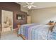 Vaulted ceiling main bedroom with adjacent bathroom and walk in closet at 12531 Midpointe Dr, Riverview, FL 33578