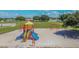 Community playground equipment with slides and swings located in a well maintained neighborhood park at 12531 Midpointe Dr, Riverview, FL 33578