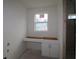 Unfinished bathroom vanity area, providing a blank canvas for custom design and functionality at 1311 S Moody Ave # 1, Tampa, FL 33629