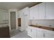Bright kitchen featuring custom white cabinets and stainless steel hardware, offering a modern look at 1311 S Moody Ave # 1, Tampa, FL 33629