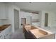 Spacious kitchen with white cabinets, stainless steel hardware, and a central island under construction at 1311 S Moody Ave # 1, Tampa, FL 33629