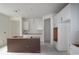 A spacious kitchen featuring unfinished cabinets, providing an open and customizable design at 1311 S Moody Ave # 1, Tampa, FL 33629