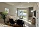 Bright living room boasts a white sofa, stylish decor, and sliding glass doors to the backyard at 1311 S Moody Ave # 1, Tampa, FL 33629