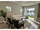 Bright living room boasts a white sofa, stylish decor, and sliding glass doors to the backyard at 1311 S Moody Ave # 1, Tampa, FL 33629