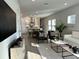 A spacious living room with an open floor plan leading into a modern kitchen at 1311 S Moody Ave # 1, Tampa, FL 33629