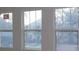 Three newly installed windows bringing in natural light and enhancing the interior space at 1311 S Moody Ave # 1, Tampa, FL 33629