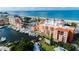 Aerial view featuring a marina with boat docks and condos near the beach at 13235 Gulf Blvd # 502, Madeira Beach, FL 33708