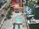 Aerial view of a pool, hot tub, marina and condos at 13235 Gulf Blvd # 502, Madeira Beach, FL 33708