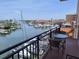 Balcony with a table and seating overlooking the marina at 13235 Gulf Blvd # 502, Madeira Beach, FL 33708