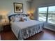 Bedroom with a large bed and window providing a view of the outdoors at 13235 Gulf Blvd # 502, Madeira Beach, FL 33708
