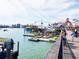 Scenic boardwalk view with jet ski rentals and waterfront shops for a fun day out at 13235 Gulf Blvd # 502, Madeira Beach, FL 33708