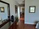 Hallway with a mirror and a view of the entry door at 13235 Gulf Blvd # 502, Madeira Beach, FL 33708
