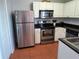 Well-equipped kitchen with stainless steel appliances, and ample cabinet space at 13235 Gulf Blvd # 502, Madeira Beach, FL 33708