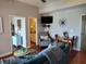 Inviting living room featuring cozy seating, a dining area, and sleek television at 13235 Gulf Blvd # 502, Madeira Beach, FL 33708
