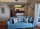 Cozy living room with a glimpse into the well-equipped kitchen at 13235 Gulf Blvd # 502, Madeira Beach, FL 33708