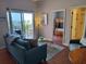 Comfortable living room leading to a bedroom and bathroom at 13235 Gulf Blvd # 502, Madeira Beach, FL 33708
