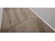 Close-up of clean, neutral-toned carpeting with subtle striped pattern in the hallway at 1353 Camelot Ct, Palm Harbor, FL 34684