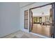 Inviting entranceway features a neutral color palette, tile flooring, and an open view into the living space at 1353 Camelot Ct, Palm Harbor, FL 34684
