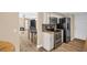 Spacious kitchen featuring stainless steel appliances, tile backsplash, and a convenient layout at 1353 Camelot Ct, Palm Harbor, FL 34684