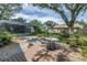 Backyard featuring a patio, in-ground pool, mature trees, and lush landscaping at 13785 Oak Forest S Blvd, Seminole, FL 33776