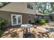 A spacious backyard with a wooden deck, leading to a patio and screened pool area at 13785 Oak Forest S Blvd, Seminole, FL 33776