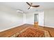 Cozy bedroom featuring wood-look flooring and an AC unit for climate control at 13785 Oak Forest S Blvd, Seminole, FL 33776