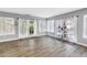Bright bonus room with laminate floors, sheer curtains and plant display at 13785 Oak Forest S Blvd, Seminole, FL 33776