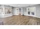 Expansive bonus room featuring wood flooring, multiple windows, and bright lighting at 13785 Oak Forest S Blvd, Seminole, FL 33776