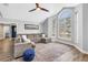 Bright living room with vaulted ceiling, expansive windows, and wood-look flooring at 13785 Oak Forest S Blvd, Seminole, FL 33776