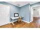 Bright office with desk, chair, and wood-look flooring, perfect for a productive workspace at 13785 Oak Forest S Blvd, Seminole, FL 33776