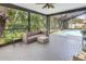 Relaxing screened patio with seating and access to the sparkling pool area at 13785 Oak Forest S Blvd, Seminole, FL 33776