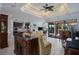 Open concept living room and kitchen with coffered ceilings and backyard access at 13878 Allamanda Cir, Port Charlotte, FL 33981